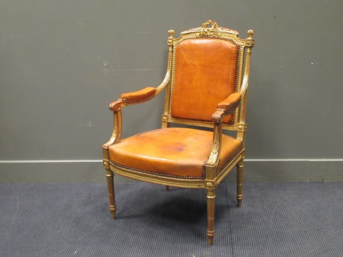 Lot 510 - A gilt wood and leather French open armchair...
