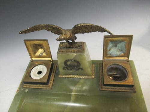 Lot 37 - An Empire style onyx and gilt brass inkwell...
