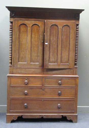 Lot 464 - An oak linen press, the bobbin turned corner...