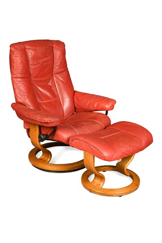 Lot 476 - An Ekornes red leather armchair with matching...