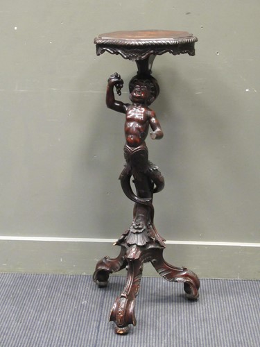 Lot 457 - A 19th century carved figural pedestal, the...