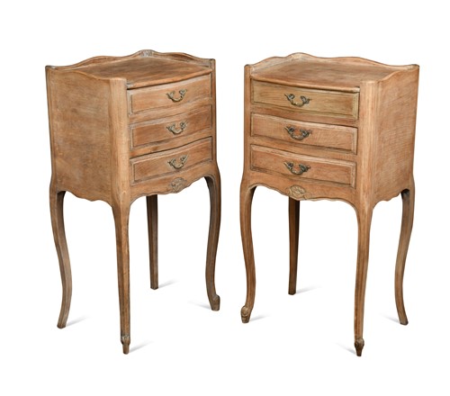 Lot 458 - A pair of French provincial bleached oak bedside cabinets, 20th century