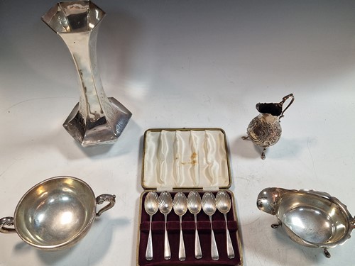Lot 215 - A silver vase, a silver bowl, silver sauce...