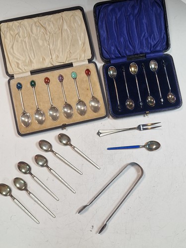 Lot 188 - A cased set of six bean end silver coffee...