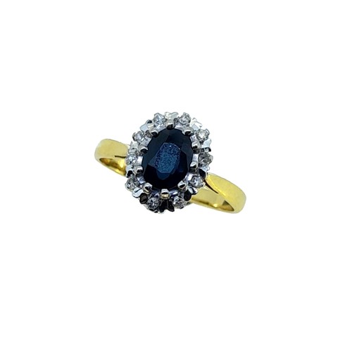 Lot 191 - A late 20th century 18ct gold sapphire and diamond cluster ring