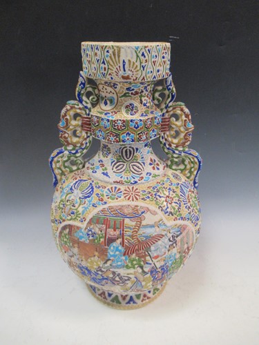 Lot 74 - Japanese earthenware tubeline decorated vase,...