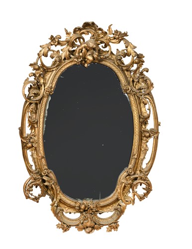Lot 513 - An oval Victorian gilt and gesso wall mirror