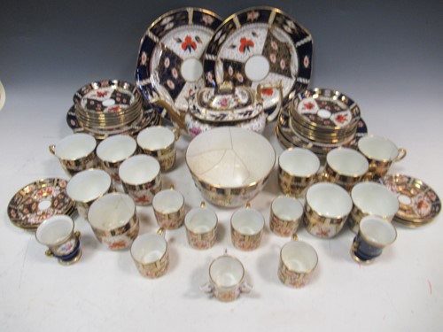 Lot 59 - A blue and gilt part tea service, together...