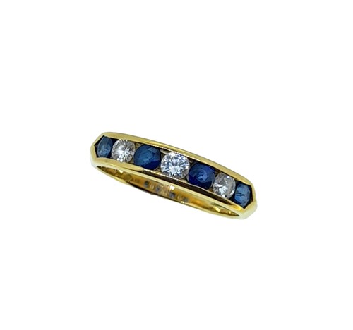 Lot 188 - An 18ct gold sapphire and diamond half hoop ring