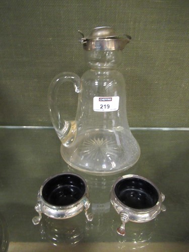 Lot 219 - A silver topped glass claret jug; together...