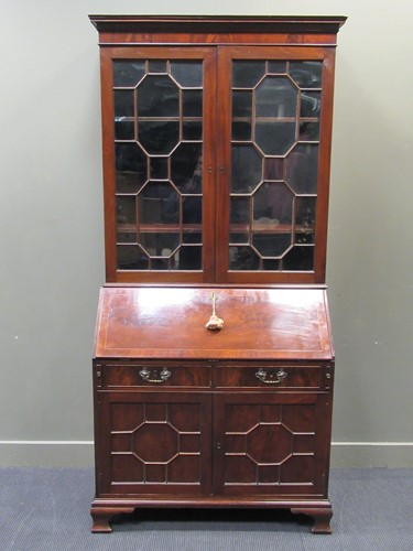 Lot 411 - An early 19th century mahogany bureau bookcase,...