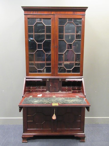 Lot 411 - An early 19th century mahogany bureau bookcase,...