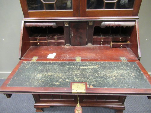 Lot 411 - An early 19th century mahogany bureau bookcase,...
