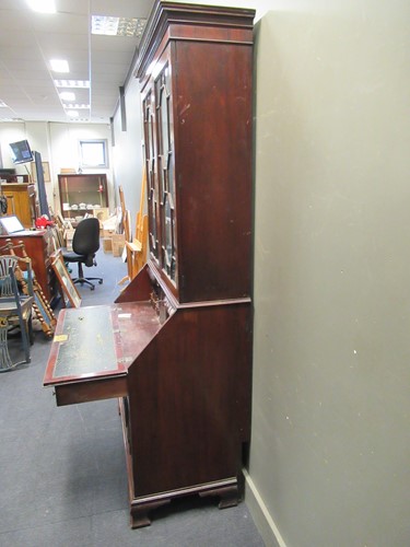 Lot 411 - An early 19th century mahogany bureau bookcase,...