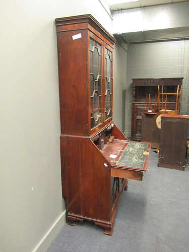 Lot 411 - An early 19th century mahogany bureau bookcase,...
