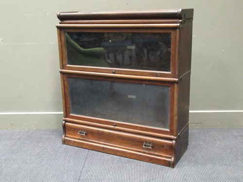 Lot 425 - A Globe Wernick sectional bookcase, comprising...