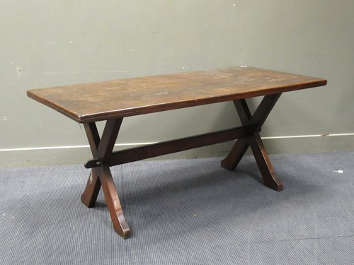 Lot 433 - An oak trestle table, the rectangular top on...