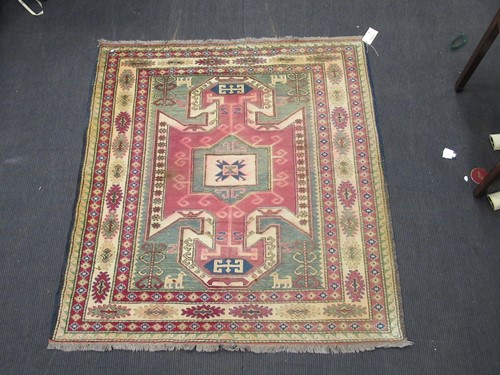 Lot 592 - A modern Turkish rug with central spiked...