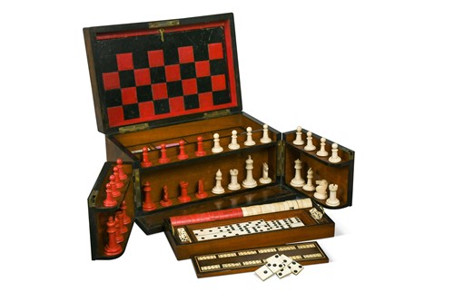 Lot 504 - A Victorian walnut games compendium