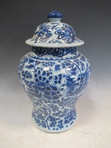 Lot 22 - A blue and white lidded jar, in Kangxi style,...