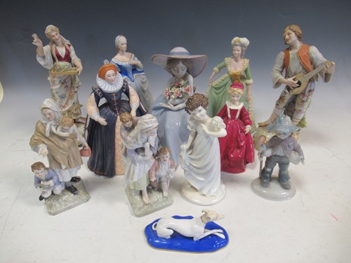 Lot 63 - A collection of ceramic figures, to include...
