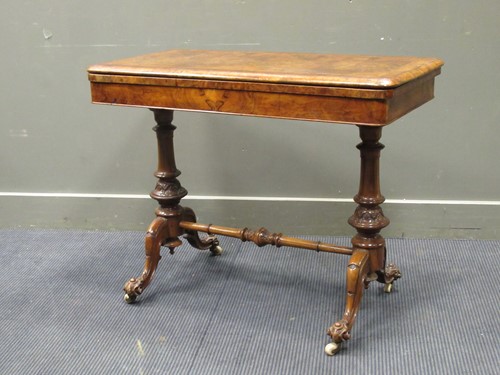 Lot 489 - A Victorian walnut rectangular fold over games...