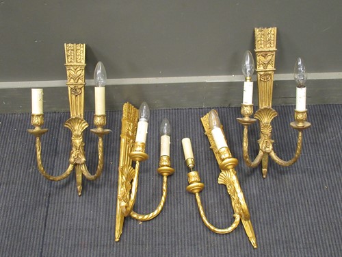 Lot 531 - A set of four Neo-classical style gilt painted...