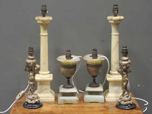 Lot 526 - A pair of gilt metal mounted onyx vase shaped...