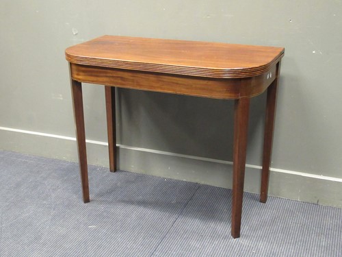 Lot 428 - A 19th century mahogany tea table, fold over...