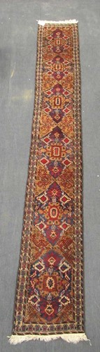 Lot 590 - A Persian runner, 475 x 67cm