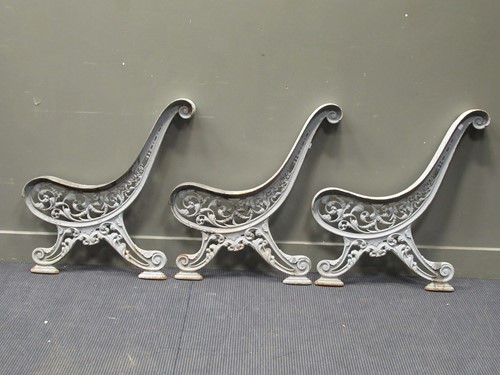 Lot 502 - A set of three Victorian cast iron garden seat...