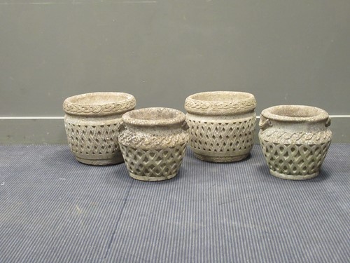 Lot 578 - A pair of composite garden urns marked...