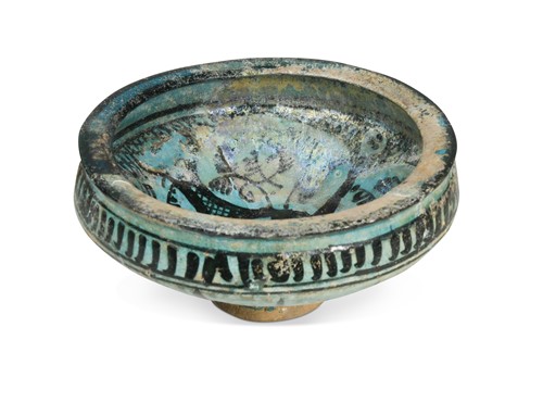 Lot 750 - A Kashan turquoise and black painted pottery conical bowl, possibly 13th/14th century