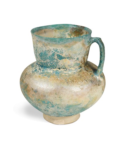 Lot 749 - A Kashan turquoise blue glazed jug, probably 12th/13th century