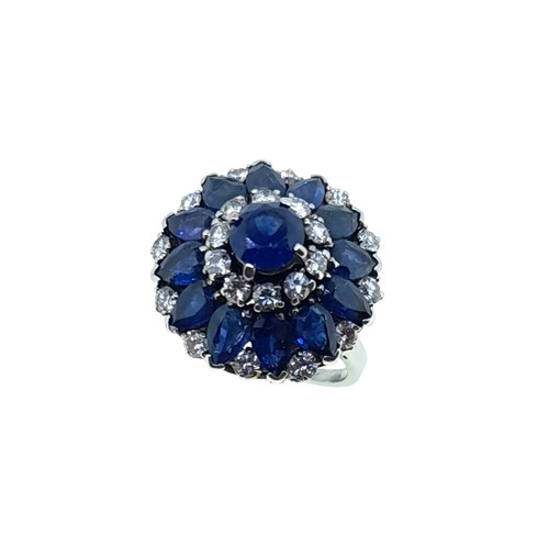 Lot 181 - A late 20th century sapphire and diamond cluster ring