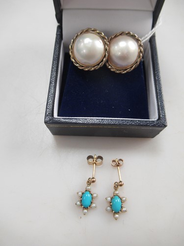 Lot 176 - A pair of mabé pear ear studs stamped '9CT'...