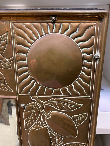 Lot 152 - A Keswick School of Industrial Arts brass framed wall mirror