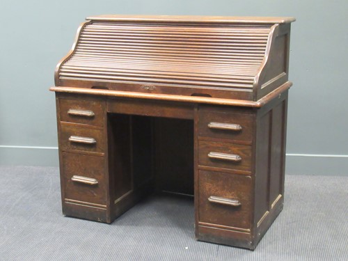 Lot 419 - An oak roll top desk, early 20th century, 113...