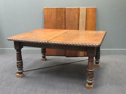 Lot 428 - A late Victorian oak extending dining table...