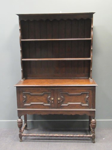 Lot 435 - A dark oak shelf back dresser, 194 x 121 x...