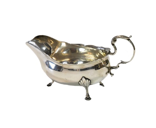Lot 658 - Newcastle - A George II silver sauce boat