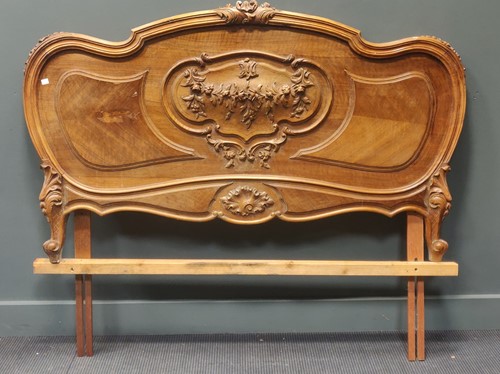Lot 503 - A French carved walnut double headboard and a...