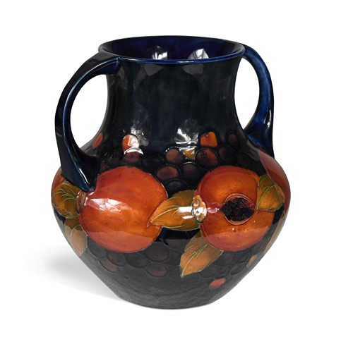 Lot 29 - A Moorcroft Pomegranate pattern twin-handled amphora vase