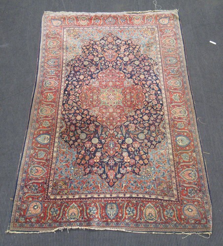 Lot 519 - A red ground Persian rug, 205 x 130cm