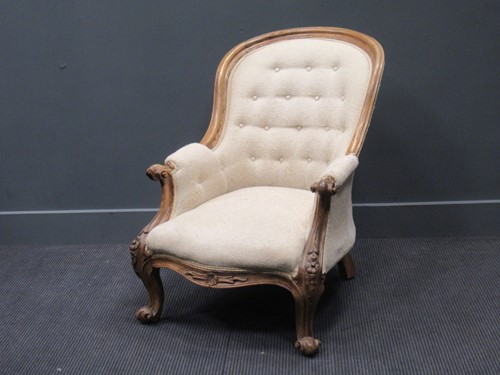 Lot 388 - A Victorian button back armchair in cream