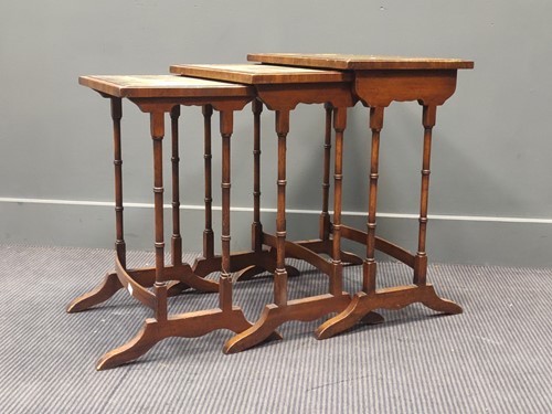 Lot 397 - A Regency style nest of 3 tables with leather...
