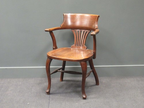 Lot 423 - An Edwardian mahogany desk armchair on...