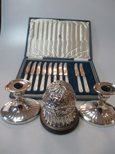 Lot 236 - A pair of silver dwarf candlesticks, together...