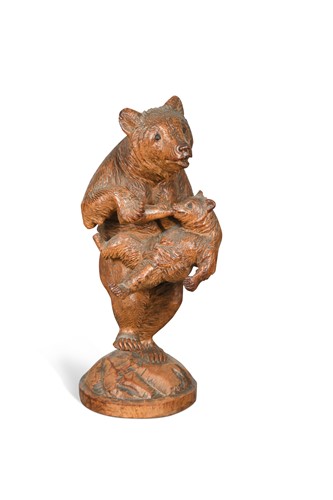 Lot 702 - A Black Forest carved wood model of a bear feeding a cub, early 20th century