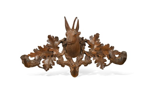 Lot 707 - A set of carved Black Forest coat hooks, early 20th century
